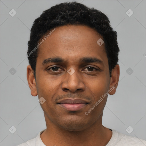 Joyful black young-adult male with short  black hair and brown eyes