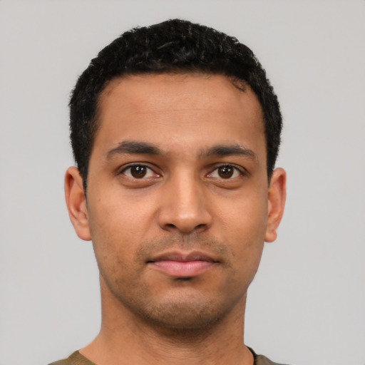 Neutral latino young-adult male with short  black hair and brown eyes
