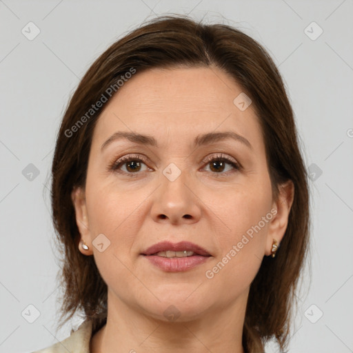 Joyful white adult female with medium  brown hair and brown eyes