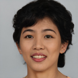 Joyful asian young-adult female with medium  black hair and brown eyes