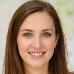 Joyful white young-adult female with long  brown hair and green eyes