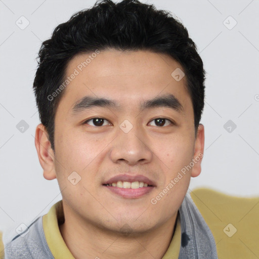 Joyful asian young-adult male with short  brown hair and brown eyes