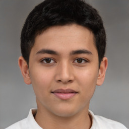 Joyful latino young-adult male with short  brown hair and brown eyes