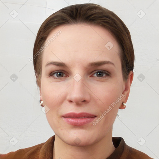 Joyful white young-adult female with short  brown hair and grey eyes