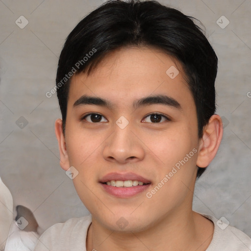 Joyful asian young-adult male with short  black hair and brown eyes