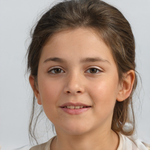 Joyful white child female with medium  brown hair and brown eyes