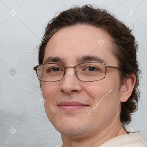 Joyful white adult female with short  brown hair and brown eyes