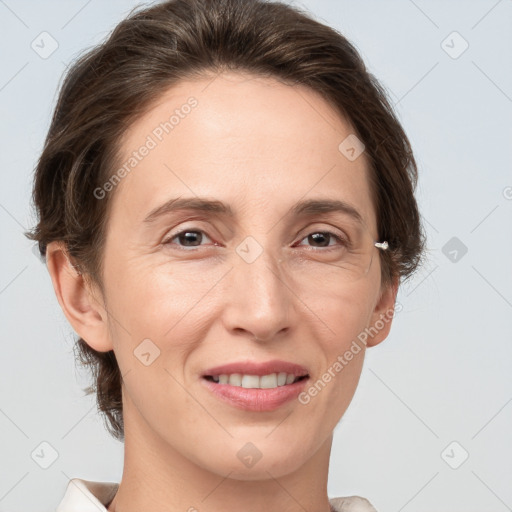 Joyful white adult female with medium  brown hair and grey eyes