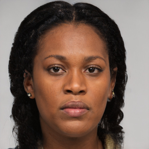Neutral black young-adult female with long  brown hair and brown eyes