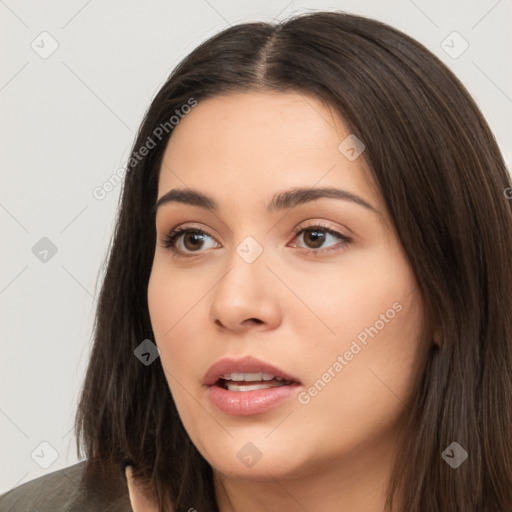 Neutral white young-adult female with long  brown hair and brown eyes