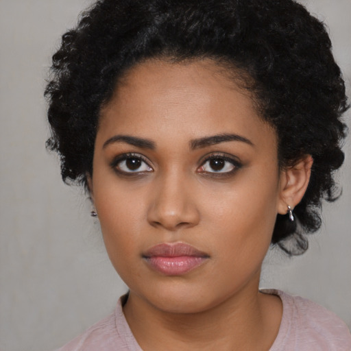 Neutral latino young-adult female with medium  black hair and brown eyes