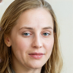 Joyful white young-adult female with long  brown hair and blue eyes