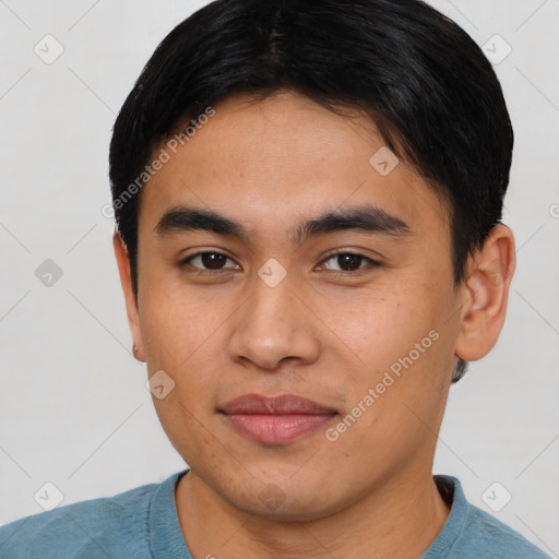 Joyful asian young-adult male with short  brown hair and brown eyes