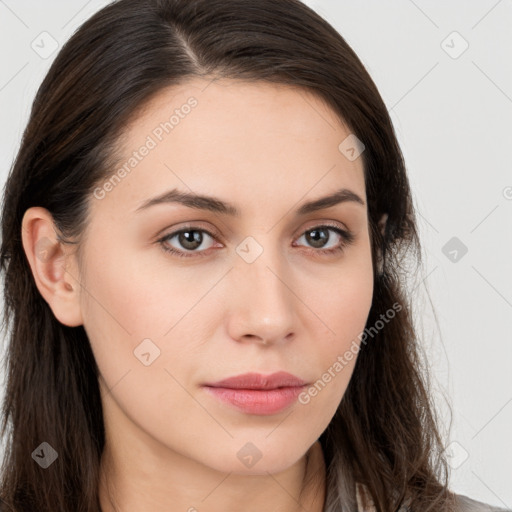 Neutral white young-adult female with long  brown hair and brown eyes