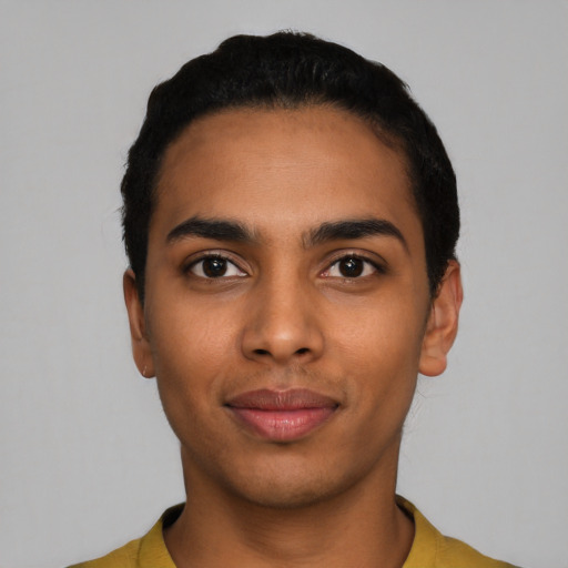 Joyful latino young-adult male with short  black hair and brown eyes