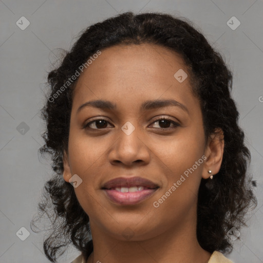 Joyful black young-adult female with medium  brown hair and brown eyes