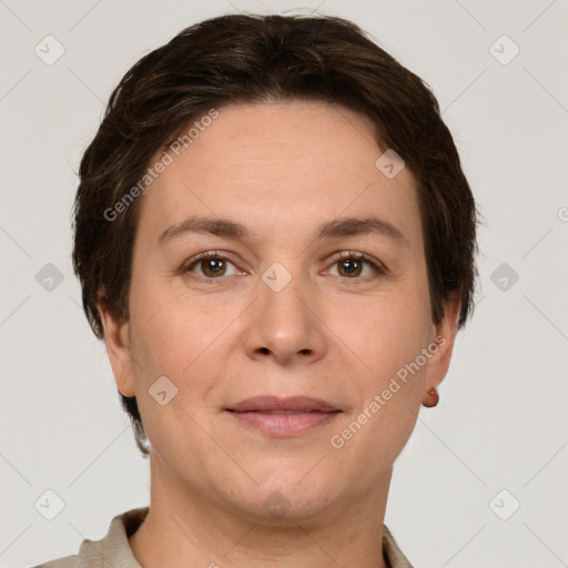 Joyful white adult female with short  brown hair and grey eyes