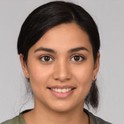 Joyful white young-adult female with medium  brown hair and brown eyes