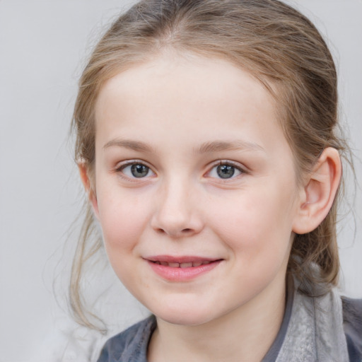 Joyful white child female with medium  brown hair and blue eyes