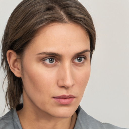 Neutral white young-adult female with medium  brown hair and grey eyes