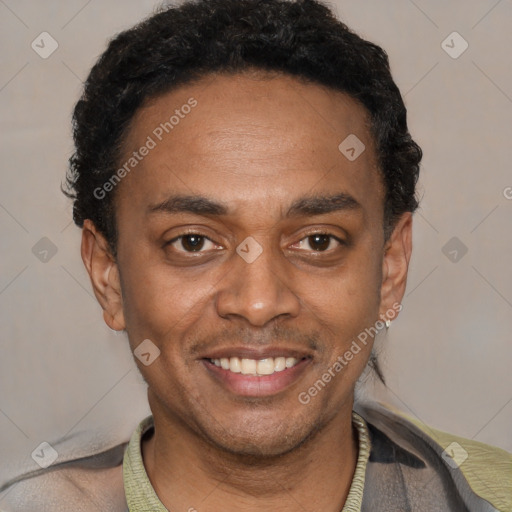 Joyful black young-adult male with short  black hair and brown eyes