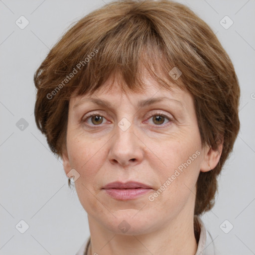 Joyful white adult female with medium  brown hair and grey eyes