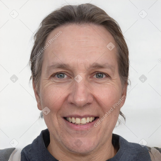 Joyful white adult female with medium  brown hair and grey eyes