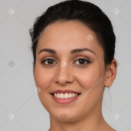 Joyful white young-adult female with short  brown hair and brown eyes