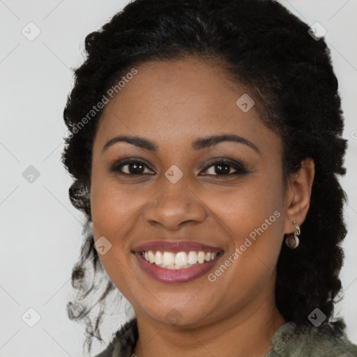 Joyful black young-adult female with long  brown hair and brown eyes