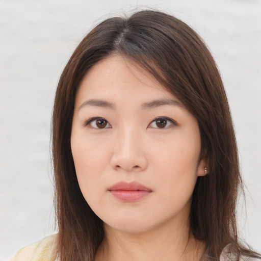 Neutral asian young-adult female with medium  brown hair and brown eyes
