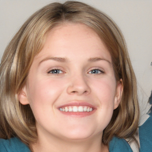 Joyful white young-adult female with medium  brown hair and blue eyes