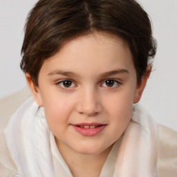 Joyful white child female with short  brown hair and brown eyes