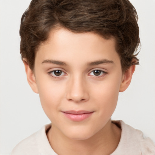 Joyful white child male with short  brown hair and brown eyes