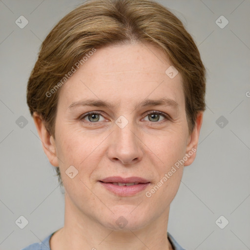 Joyful white adult female with short  brown hair and grey eyes