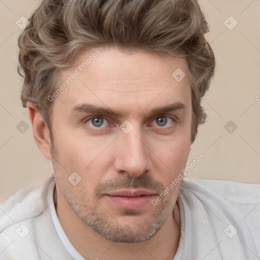 Joyful white adult male with short  brown hair and grey eyes