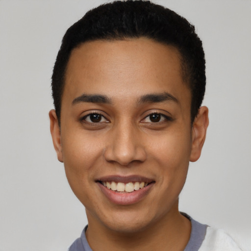 Joyful latino young-adult male with short  black hair and brown eyes