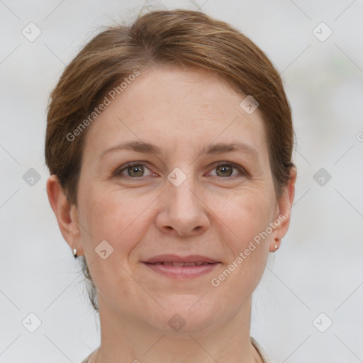 Joyful white adult female with short  brown hair and grey eyes