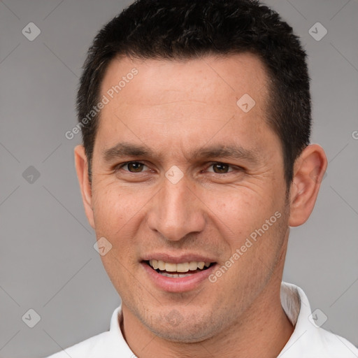 Joyful white adult male with short  brown hair and brown eyes