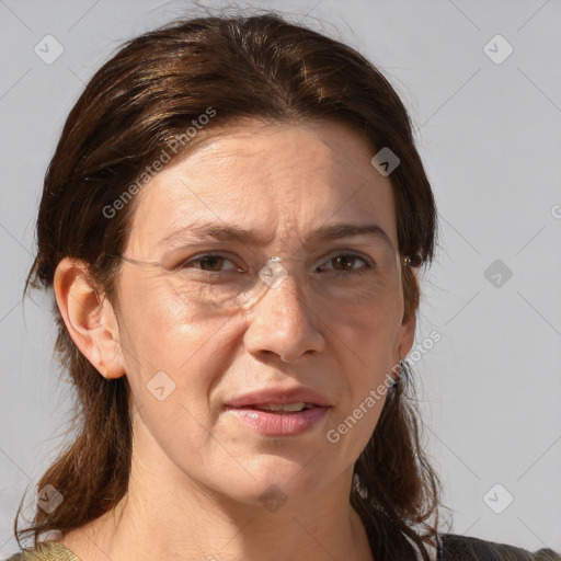 Joyful white adult female with medium  brown hair and grey eyes