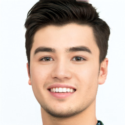 Joyful white young-adult male with short  black hair and brown eyes