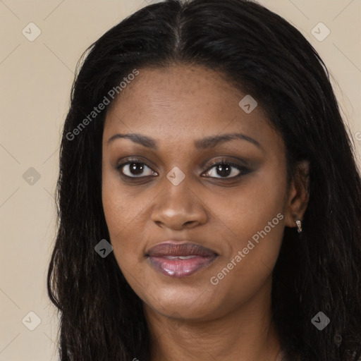 Joyful black young-adult female with long  brown hair and brown eyes