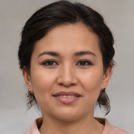 Joyful asian young-adult female with medium  brown hair and brown eyes