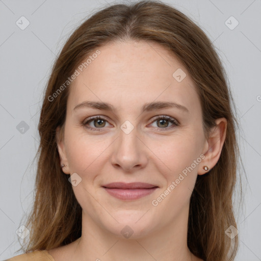 Joyful white young-adult female with long  brown hair and grey eyes