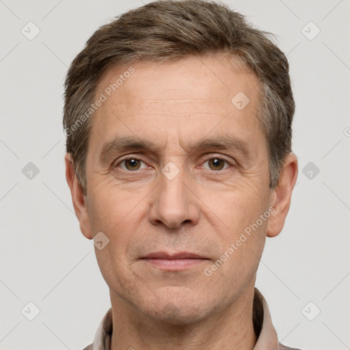 Joyful white adult male with short  brown hair and grey eyes