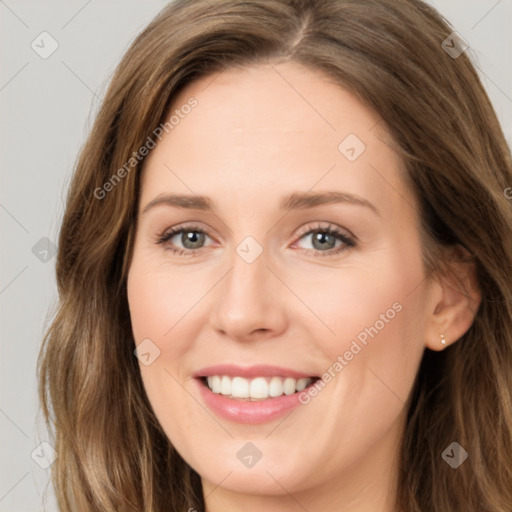 Joyful white young-adult female with long  brown hair and green eyes