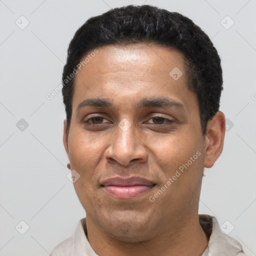 Joyful latino young-adult male with short  black hair and brown eyes