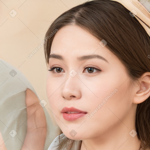 Neutral white young-adult female with long  brown hair and brown eyes