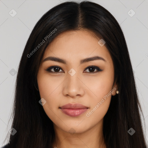 Joyful latino young-adult female with long  black hair and brown eyes