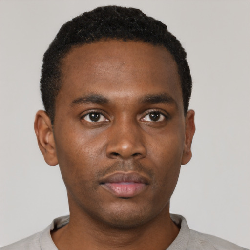 Neutral black young-adult male with short  black hair and brown eyes