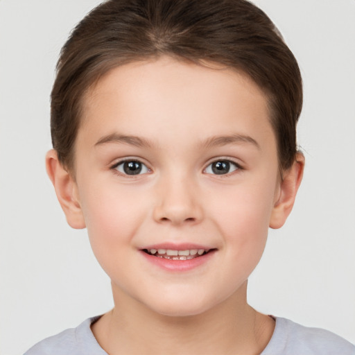 Joyful white child female with short  brown hair and brown eyes